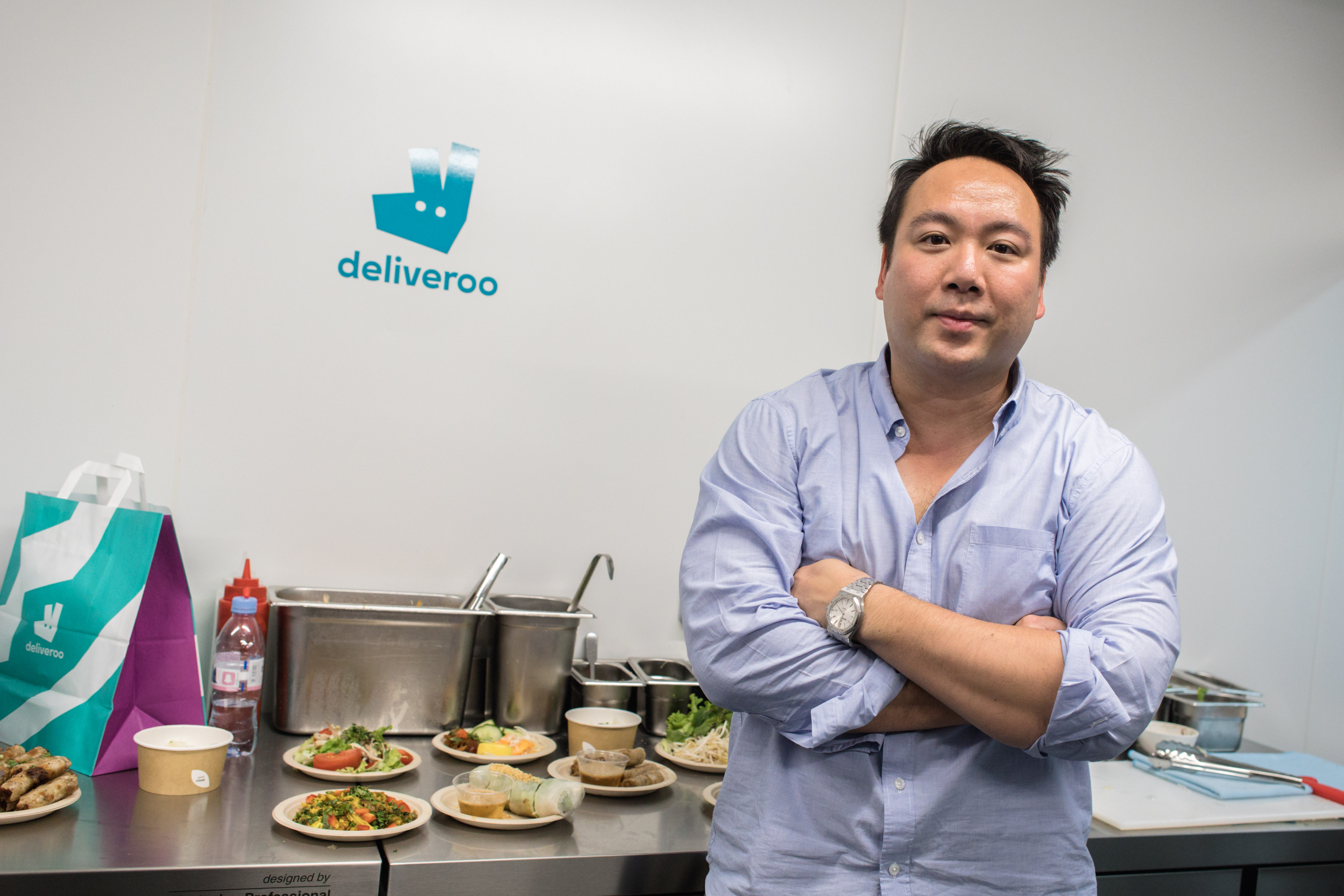 Will Shu, Deliveroo CEO, standing in a Deliveroo Editions kitchen.
